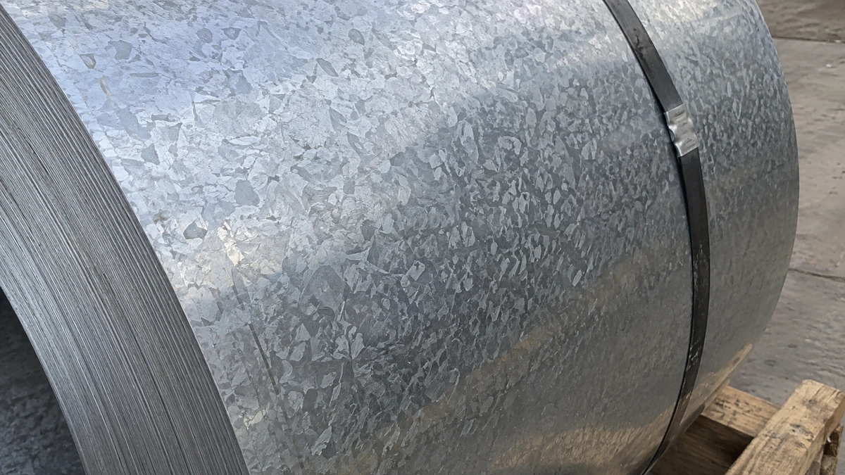 Hot-dip galvanized steel coil, the zinc surface showing a regular spangle pattern.