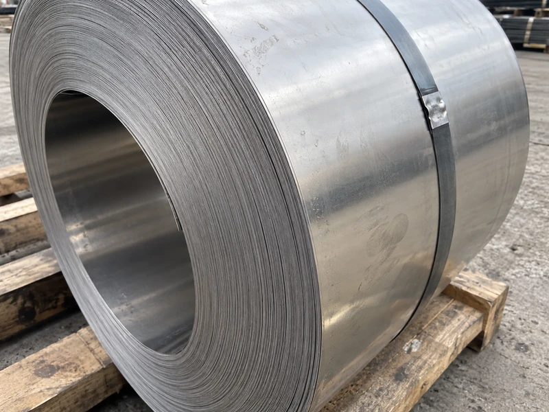 Close-up of a cold rolled stainless steel coil with the cut edge to the camera.