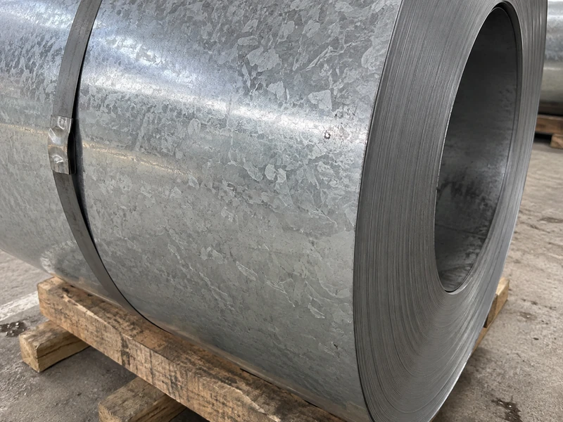 Close-up of an SGCC coil face, the zinc coating and the spangle pattern visible.