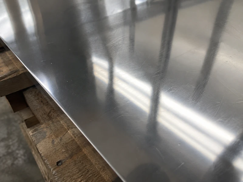 A 304 sheet in BA finish reflecting the light, the reflection sharp.